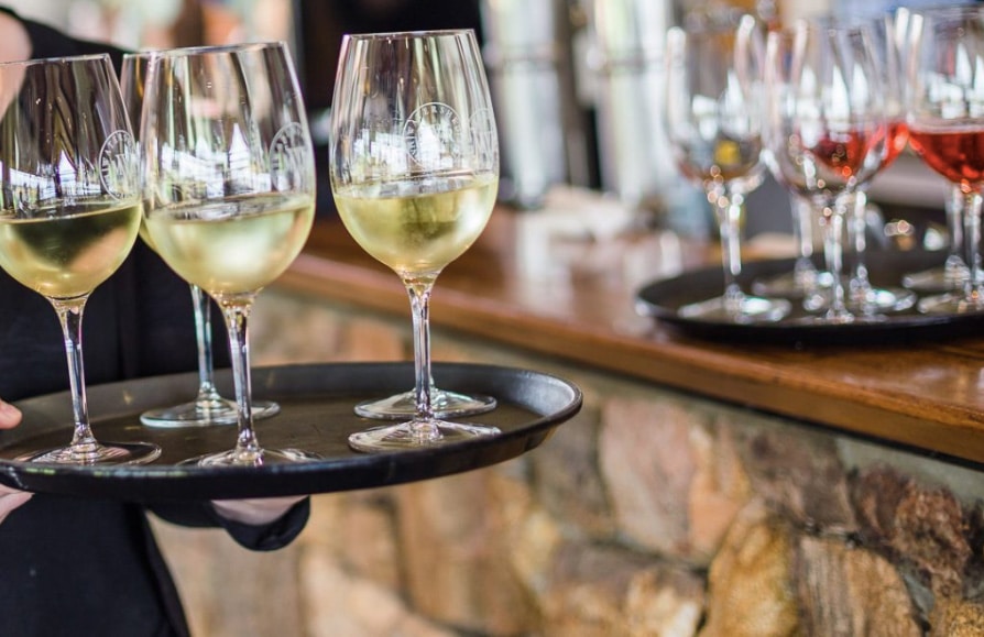Wine Glasses Being Served From A Tray